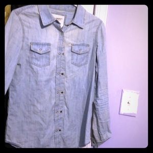 A denim button up shirt